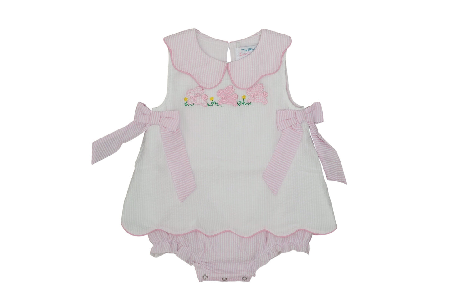 White baby romper with pink accents on a white background