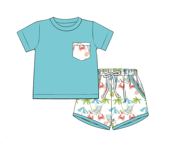 Children's blue t-shirt with a pocket and patterned shorts on a white background