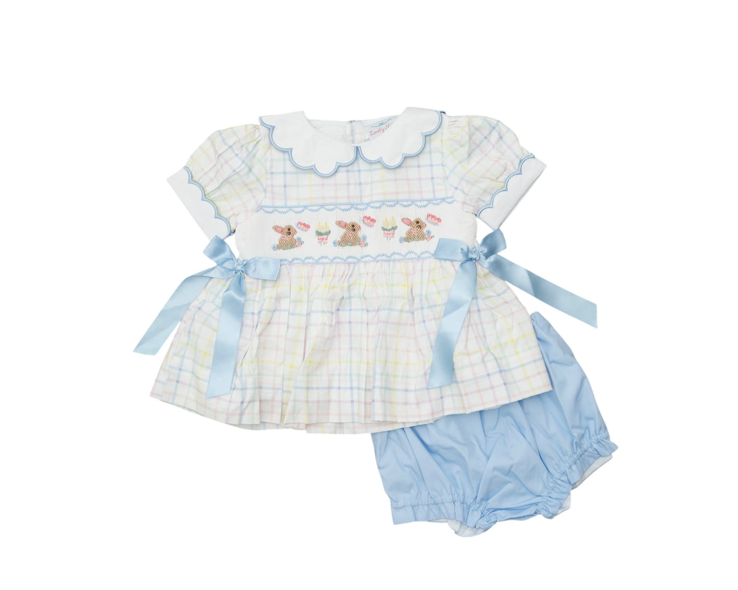Baby girl's dress and bloomers set with checkered pattern and embroidered details on a white background