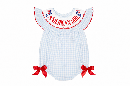White checkered baby romper with red accents and 'American Girl' text on a white background