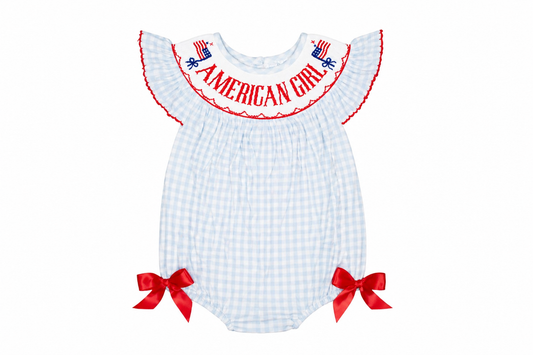 White checkered baby romper with red accents and 'American Girl' text on a white background