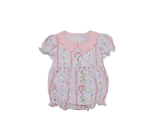 Baby romper with floral pattern and pink collar on a white background