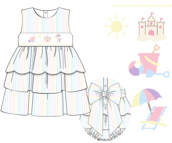 Children's dress with rainbow stripes and matching bloomers, surrounded by beach-themed illustrations on a white background.