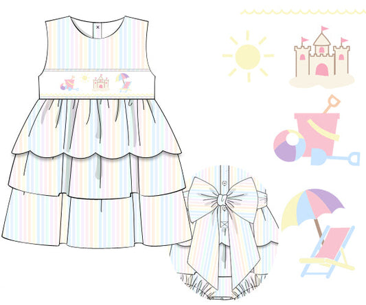 Children's dress with rainbow stripes and matching bloomers, surrounded by beach-themed illustrations on a white background.