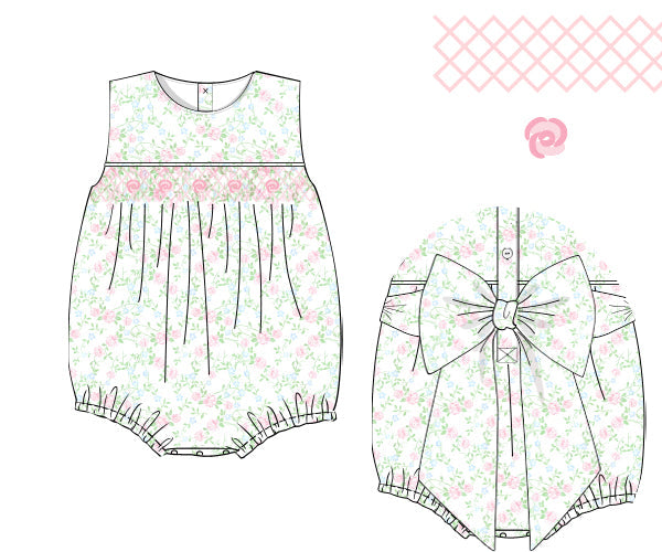 Sewing pattern for a baby romper with floral design on a white background