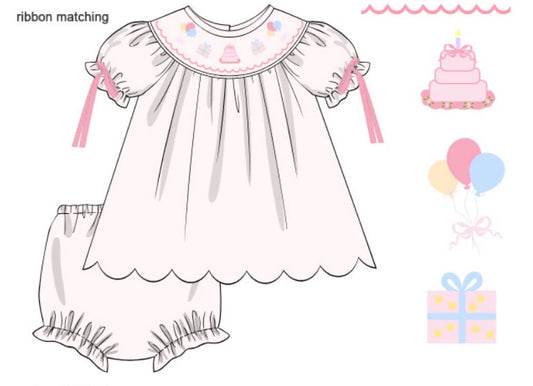 Children's dress with matching bloomers and accessories on a white background