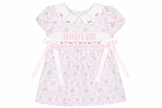 Baby dress with 'Mama's Girl' text and floral pattern on a white background