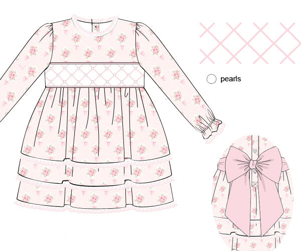 A sewing pattern or design illustration of a girls' dress with long sleeves, a smocked bodice, and a tiered skirt in a pale pink floral print. The image includes a small inset showing a large pink bow detail and a fabric swatch labeled 'pearls' on a white background.