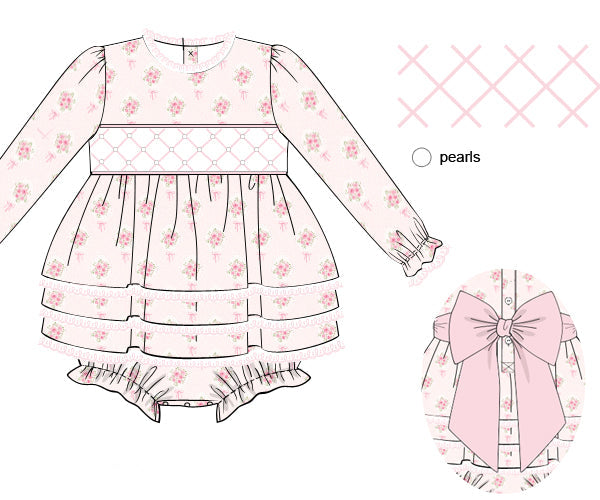 A sewing pattern illustration of a long-sleeve baby dress in pale pink with a small floral print, featuring a smocked bodice, tiered skirt, and ruffled leg ruffles. Includes a close-up inset of a large bow detail and a color swatch labeled pearls.