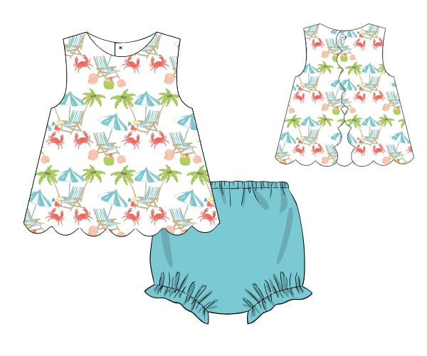 Children's dress with beach pattern and blue bloomers on a white background