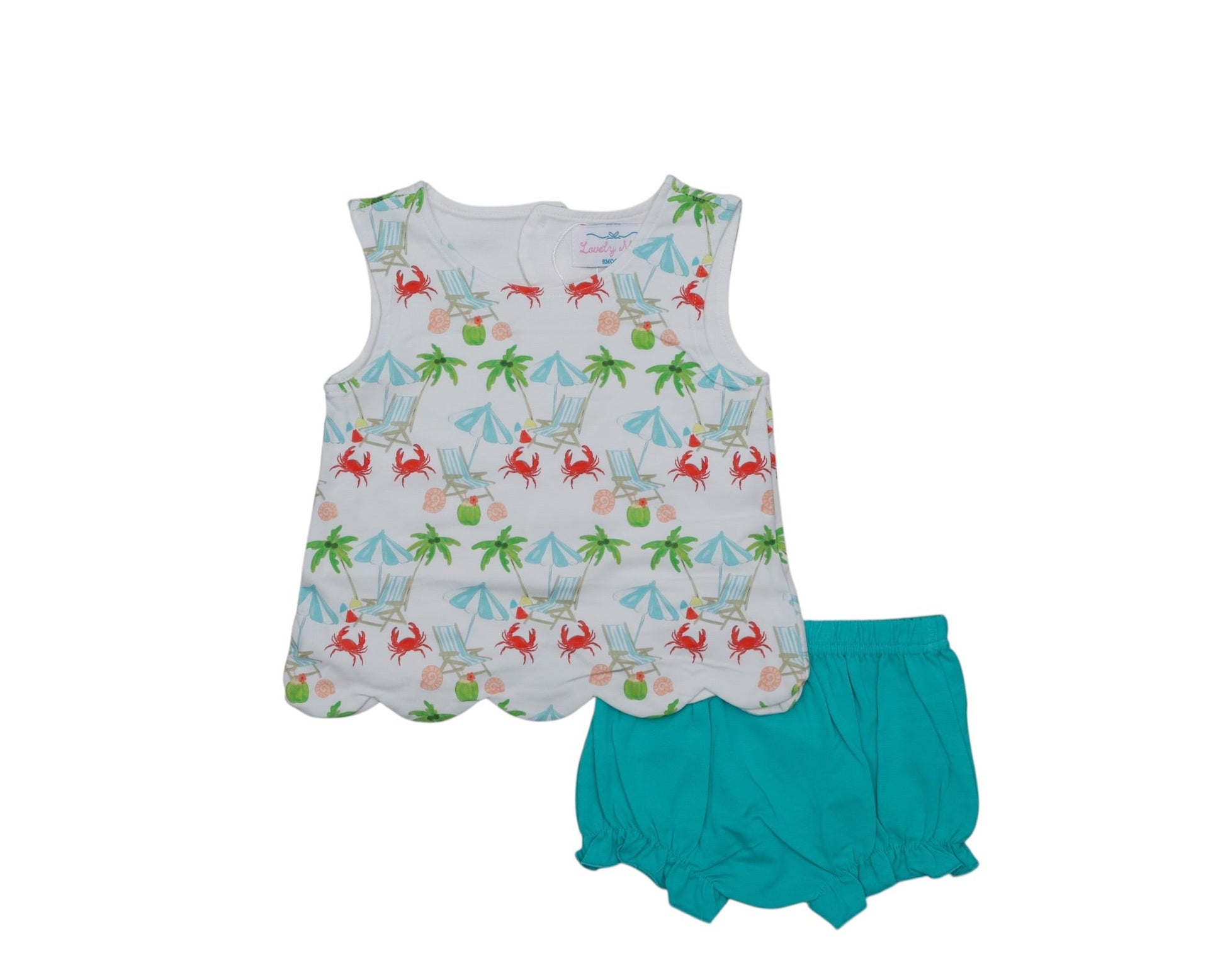 Children's dress with crab and palm tree pattern and teal shorts on a white background