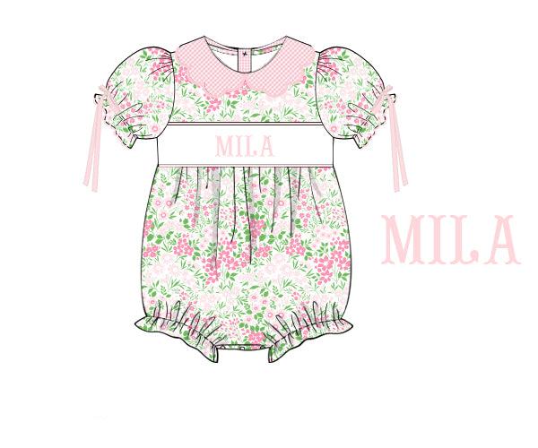 100% cotton Floral Mama’s Girl Petal Pop Bubble with hand-smocked MAMA’S GIRL, flowers, bow, and petal-inspired skirt. Classic heirloom design.