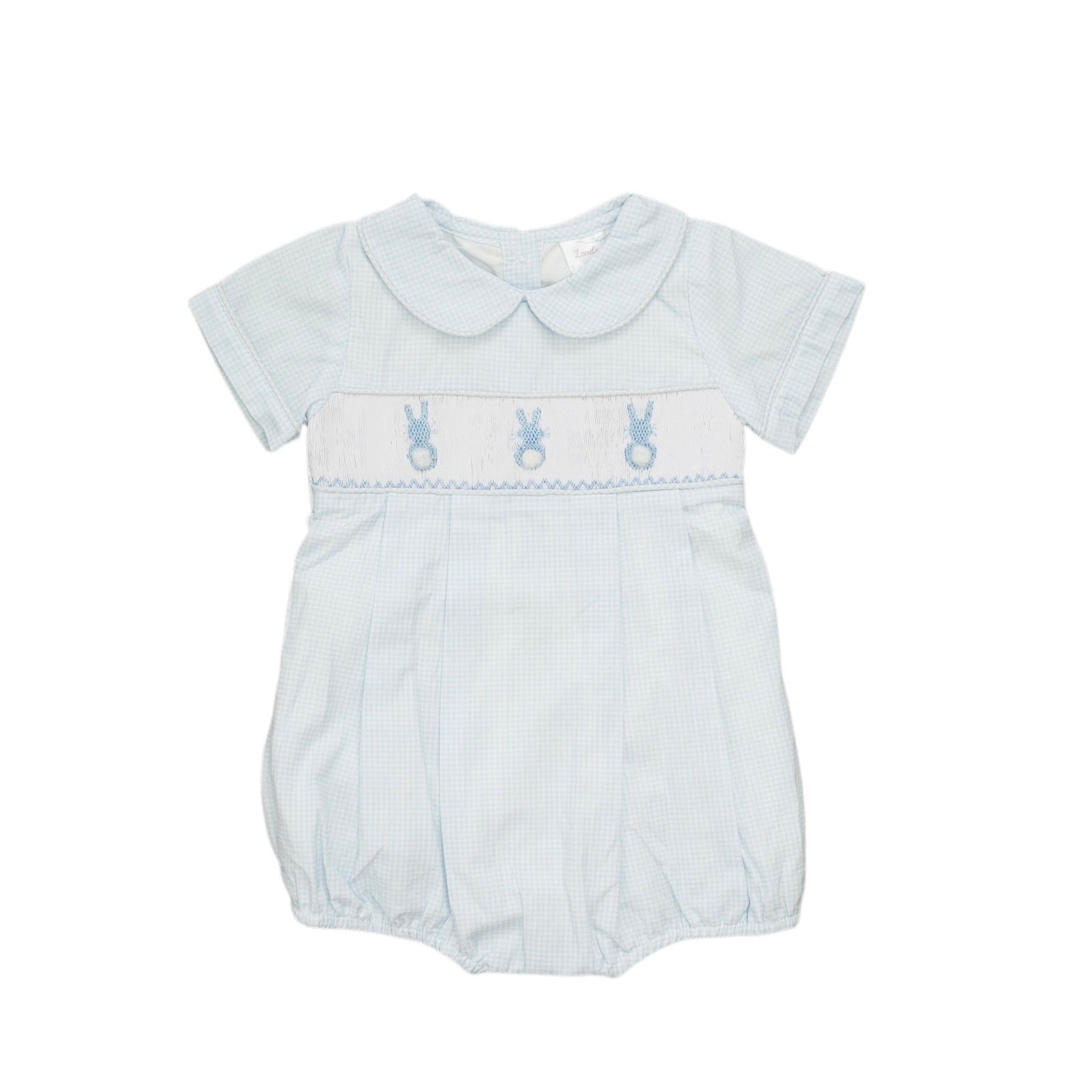Baby romper with embroidered details on a white background