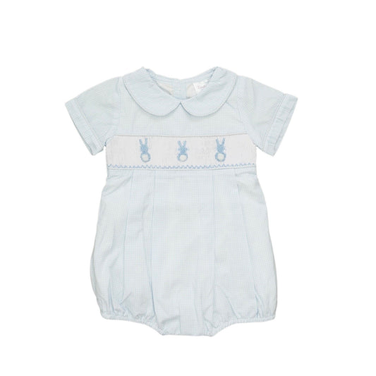 Baby romper with embroidered details on a white background