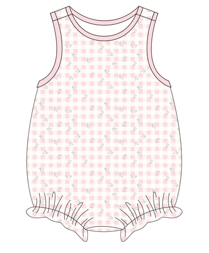 Pink checkered romper with floral pattern on a white background