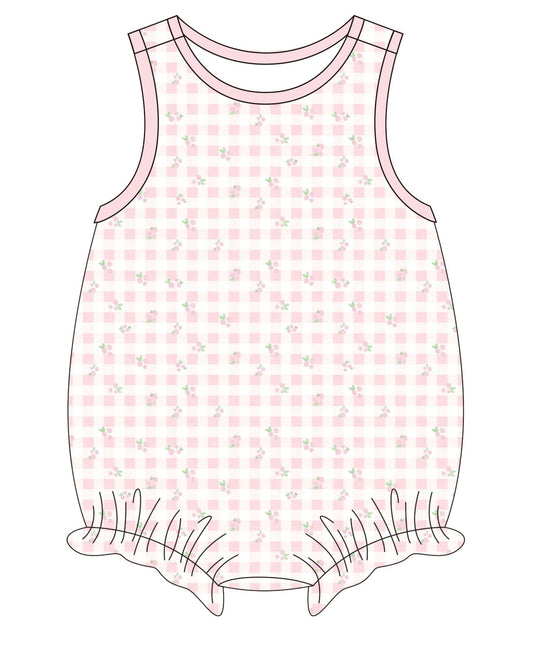 Pink checkered romper with floral pattern on a white background