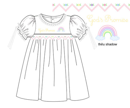 God’s Promise Dress in white cotton, featuring rainbow shadow embroidery and hand-smocked rosettes on the bodice.
