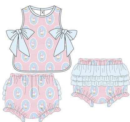 Children's outfit set with pink top and shorts featuring blue patterns on a white background