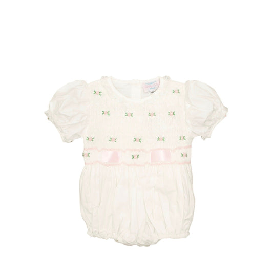 White baby romper with floral details on a white background