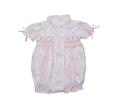 White baby romper with pink floral patterns on a white background