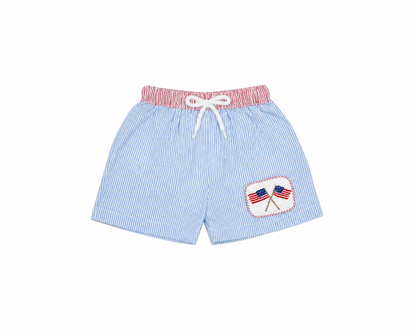 Light blue shorts with red and white trim and a small flag design on a white background