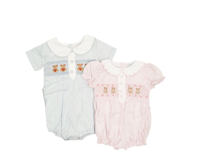 Two baby rompers, one light blue and one pink, with embroidered teddy bears on a white background.
