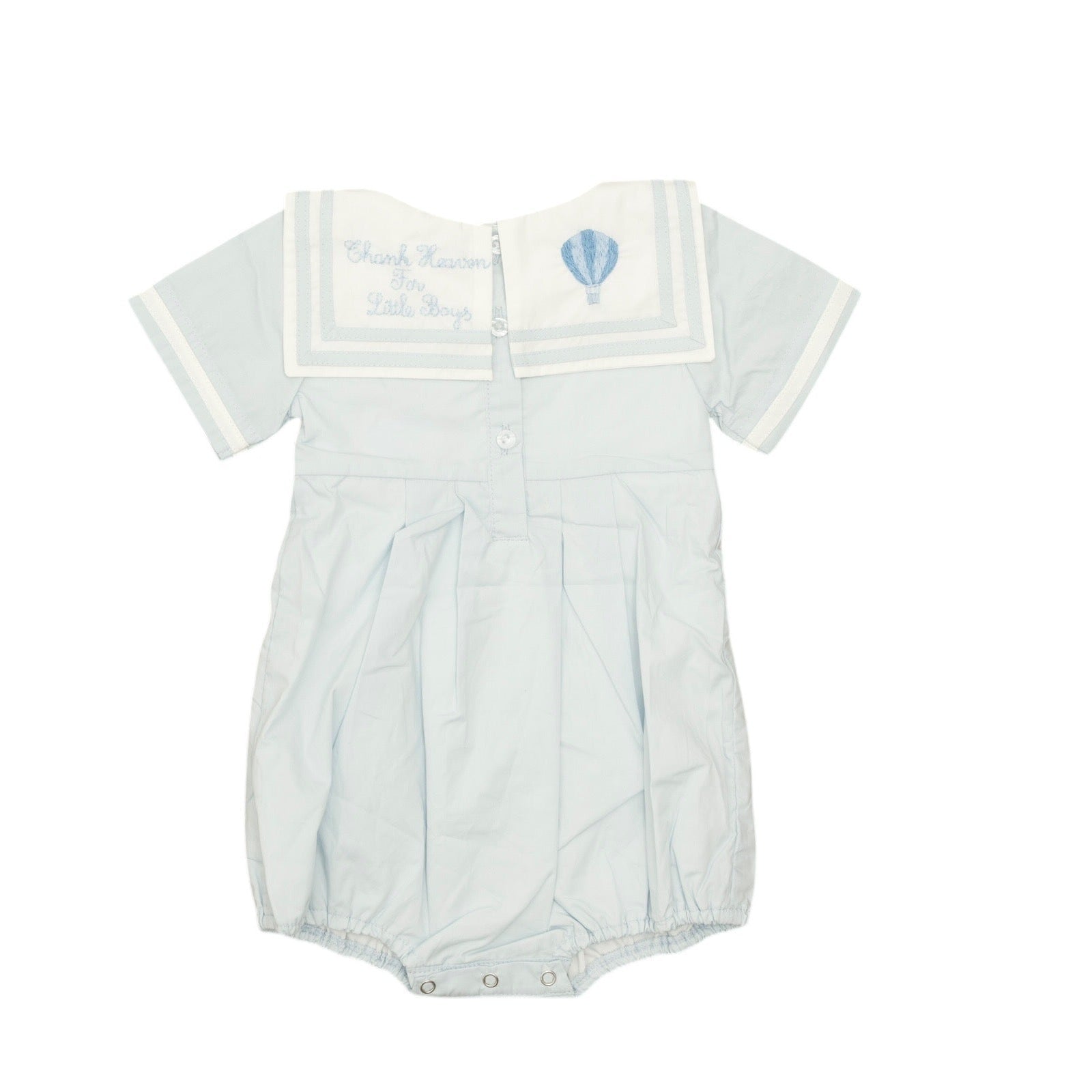 White baby romper with blue air ballon design on a white background