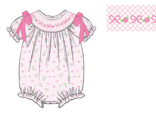 The Belle Fleur hand-smocked bubble romper with floral detailing and soft cotton fabric. Perfect for birthdays, portraits, holidays, and everyday wear.