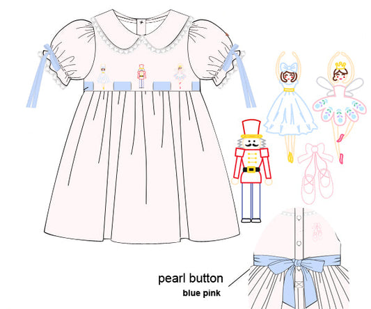 Children's dress pattern with embroidered details and labels on a white background
