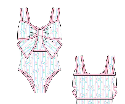 Women’s Tropical Swimsuit with large front bow in rashguard swim material. Coordinated family swim look. Perfect for beach, pool, and tropical vacations.