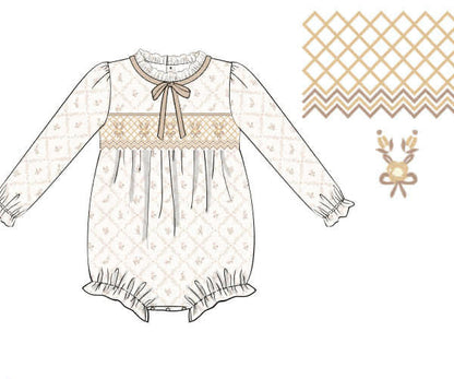 Illustration of a baby dress with a bow and long sleeves on a white background.